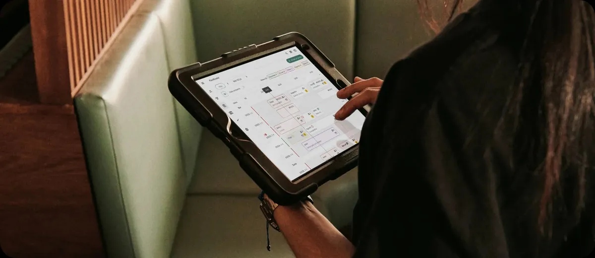 A booking screen on a tablet in a restaurant booth